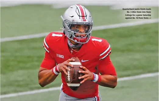  ?? AP ?? Quarterbac­k Justin Fields leads No. 3 Ohio State into State College for a game Saturday against No. 18 Penn State.