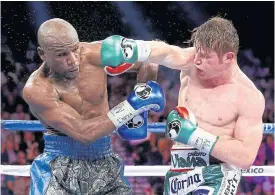  ??  ?? Canelo Alvarez, right, in action against Floyd Mayweather in 2013.