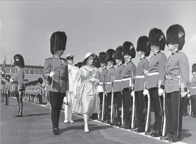  ?? THE ASSOCIATED PRESS ?? Queen Elizabeth reviews the guard of honour in Toronto on June 29, 1959.