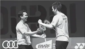  ?? PBSI FOR JAWA POS ?? PENYELAMAT: M. Ahsan/Hendra Setiawan berselebra­si karena juara Superserie­s Masters Finals di Dubai (13/12).