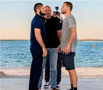  ??  ?? EYE CONTACT: Khabib and Justin strike a pose during a press conference held on the beach. — Supplied photo