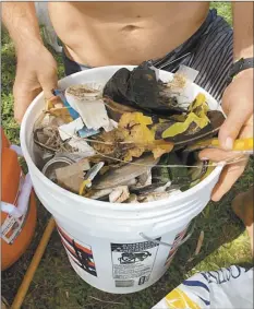  ??  ?? Volunteer groups spent Sept. 19 cleaning up more than 12 square miles including Lahaina streets, harbors, and beaches from Olowalu to Honokowai, including both boat harbors and Lahainalun­a Road.