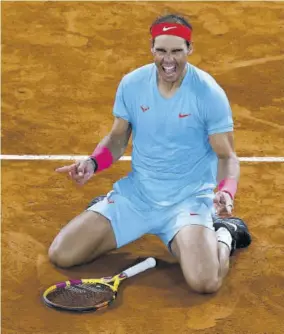  ??  ?? Spain’s Rafael Nadal celebrates winning against Serbia’s Novak Djokovic at the end of their men’s final tennis match at Philippe Chatrier court on day 15 of The Roland Garros 2020 French Open tennis tournament in Paris, yesterday.