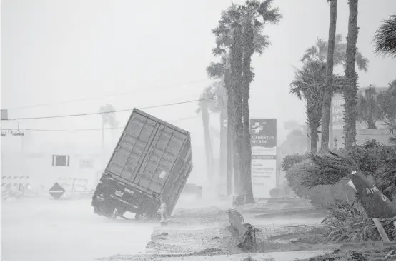  ?? Courtney Sacco / Corpus Christi Caller-Times via Associated Press ?? A power generator tips in front of Texas’ CHRISTUS Spohn Hospital Corpus Christi-Shoreline as Hurricane Harvey hits Friday.