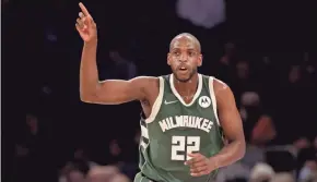  ?? GETTY IMAGES ?? Bucks forward Khris Middleton raises his finger after canning a three-pointer on his way to team-high 24 points Sunday at Madison Square Garden.