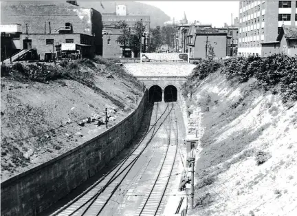  ?? COPYRIGHT MONTREAL STAR ?? The train tunnel under Mount Royal was an engineerin­g marvel but left an enormous hole in part of downtown Montreal.