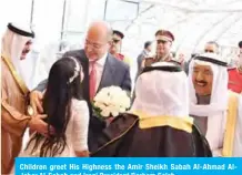  ??  ?? Children greet His Highness the Amir Sheikh Sabah Al-Ahmad AlJaber Al-Sabah and Iraqi President Barham Saleh.