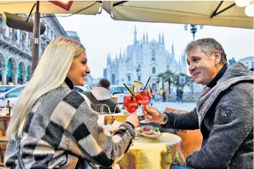  ??  ?? Loosening up: across most of the country, people in Italy can now enjoy drinks at bars – even without the vaccinatio­n success of the UK