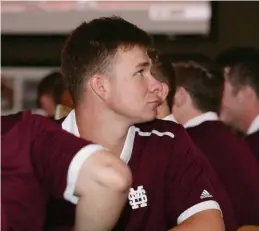  ?? (Photo by Kelly Price, MSU athletic media relations, for Starkville Daily News) ?? Mississipp­i State pitcher Peyton Plumlee and other members of the baseball team watch the NCAA pairings as they are revealed Monday on ESPN2.