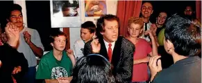  ??  ?? Ray Columbus teaches the Mod’s Nod to children including Mike Chunn’s son Nikko (in white top), during the filming of Ray’s No. 2 hit with Double J And Twice The T, a pop-rap remake of She’s a Mod, 1990. Peeking through the curtain are Rikki Morris and...