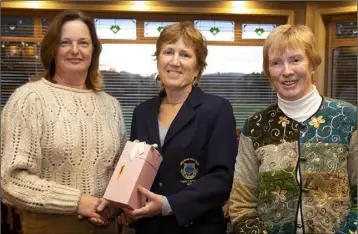  ??  ?? Pat Purcell, lady Captain of New Ross Golf Club, with two prize-winners in a club-sponsored competitio­n held before all golf activity was halted: Mary Therese Wall (winner, left) and Eileen Wallace (third, right).