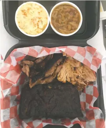  ?? PHOTO BY BARRY COURTER ?? The combo plate I chose featured brisket, pulled pork and a slab of ribs, plus baked beans and potato salad. I was able to eat about half and saved the rest for later.