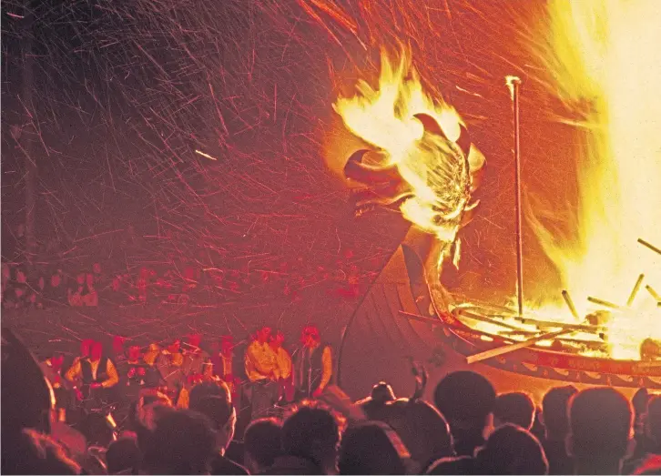  ??  ?? FIRED UP: Alastair captured this dynamic and evocative scene of a replica Viking longship set alight on Shetland during Up-Helly-Aa, Britain’s largest fire festival