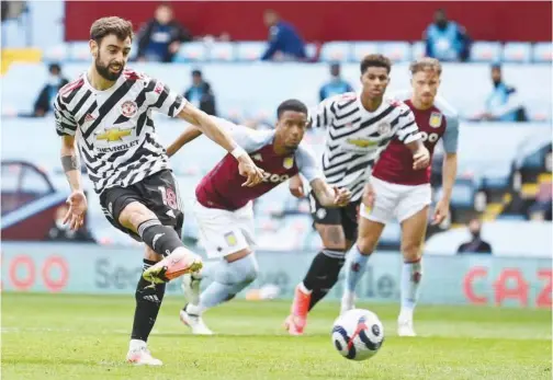  ?? Agence France-presse ?? ↑
Manchester United’s Bruno Fernandes scores against Aston Villa during their English Premier League match at Villa Park in Birmingham on Sunday.