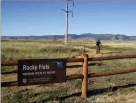  ?? DAN ELLIOTT — THE ASSOCIATED PRESS ?? Jerry Jacka departs a trailhead on his mountain bike at Rocky Flats National Wildlife Refuge outside Denver on Saturday the first day the refuge was open to the public. The refuge is on the outskirts of a former U.S. government factory that manufactur­ed plutonium triggers for nuclear weapons.