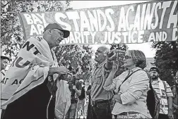  ?? [MARCIO JOSE SANCHEZ/THE ASSOCIATED PRESS] ?? Donald Trump supporter Arthur Schaper, left, argues his position with Mustafa Payrvand and Christina Tunnah during the rally Sunday in Berkeley, Calif.