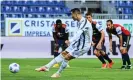  ??  ?? Cristiano Ronaldo scores his second goal against Cagliari from the spot. Photograph: Alberto Pizzoli/AFP/Getty Images