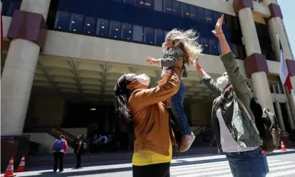  ?? Photograph: Rodrigo Garrido/Reuters ?? A couple reacts with their daughter outside the congress as the senate votes to approve a same-sex marriage bill in Valparaíso, Chile, on 7 December.