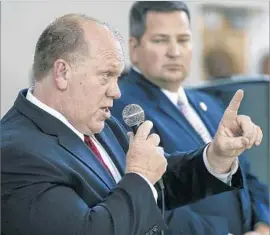  ?? Mark Boster Los Angeles Times ?? THOMAS HOMAN, acting head of U.S. Immigratio­n and Customs Enforcemen­t, left, said California’s “sanctuary state” law would “undermine public safety.”