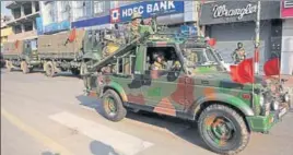  ?? NITIN KANOTRA / HINDUSTAN TIMES ?? Army personnel conduct a flag march during curfew in Jammu on Saturday, following violence over the terror attack in Pulwama.