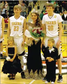  ?? MARK HUMPHREY ENTERPRISE-LEADER ?? Prairie Grove High School celebrated Colors Day Friday. Senior Parker Lopez was crowned queen. She was escorted by members of the varsity boys basketball team, Taylor Moore (left) and Cameron Simmons, accompanie­d by attendants, Allie Wilson and Jude...