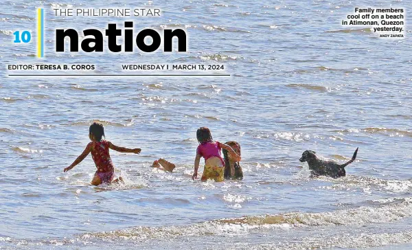  ?? ANDY ZAPATA ?? Family members cool off on a beach in Atimonan, Quezon yesterday.