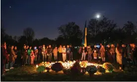  ?? Anadolu Agency/Getty Images ?? Poles and Ukrainians pay tribute to the victims of the Russian invasion. Photograph: