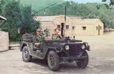  ??  ?? MEDICS IN THE BRIGADE HOSPITAL in Korea spent time waiting for emergency calls. Above, Frank gets a ride in an Army jeep. In the group photo at left, Frank is in the front row, second from left.