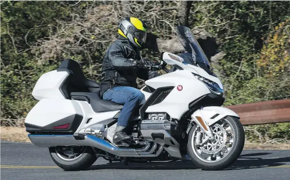  ?? — PHOTOS: HONDA ?? The Gold Wing Tour’s dramatic size reduction comes with little or no reduction in fairing coverage.