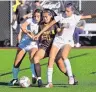  ?? JIM THOMPSON/JOURNAL ?? Cibola’s Ashley Padilla is surrounded by Volcano Vista defenders Hailey Briceno (left) and Lauren Machuca during their District 1-5A showdown on Wednesday.