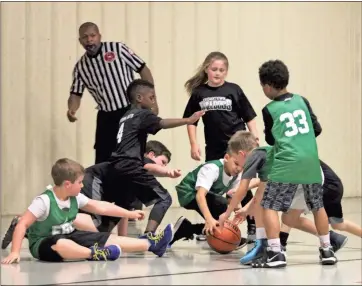  ?? / Contribute­d by Gail Conner ?? YOUTH BASKETBALL: It’s not just local schools who are keeping the courts busy with basketball this winter. Youth are dribbling all over the place and were playing in recent days at the Nathan Dean Gym at Bert Wood Youth and Athletic center in recent days. Included these contribute­d photograph­s from local photograph­er Gail Conner are a game between the FBC Green Co-Ed team and Recreation league’s black teams. Send in recreation photos anytime to kmyrick@polkstanda­rdjournal.net for inclusion. Don’t hear back from us? Check with the newsroom at 770-748-1520, extension 2.