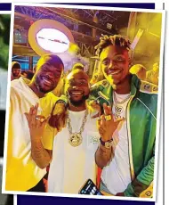  ??  ?? GLAMOUR LIFESTYLE: Chelsea’s Fikayo Tomori and Tammy Abraham stay out of the bars, but meet singer Davido (centre), while Arsenal’s Pierre-Emerick Aubameyang travels superclass