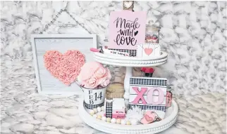  ?? CONTRIBUTE­D ?? Celebratin­g Valentine’s Day with crafts can brighten up winter. Gina Bell enjoys creating tiered trays with a Valentine’s message.