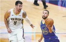  ??  ?? Curry drives past center Willy Hernangome­z in the first half of the Warriors’ 123108 win over New Orleans.