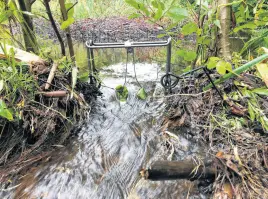  ?? PAUL SMITH ?? This is a #330 humane kill trap set on a beaver dam.