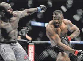  ?? Photo: Douglas P Defelice/getty Images ?? Baddest man on the planet? Francis Ngannou (right), could earn that title if he wins the UFC championsh­ip.