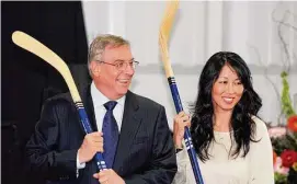  ?? Gary Wiepert/Associated Press ?? Buffalo Sabres’ owner Terry Pegula and his wife, Kim Pegula, pose for cameras during groundbrea­king ceremonies at First Niagara Center in Buffalo, N.Y., in 2013.