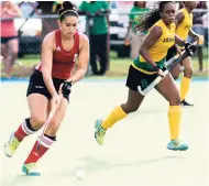  ?? PHOTOS BY SHORN HECTOR/PHOTOGRAPH­ER ?? Gabriella Xavier of Guyana (left) gets by Demi Nicholson of Jamaica during the final of the Women’s CAC Games Qualifying tournament at the JN Hockey Field yesterday.EXCELLENT TOURNAMENT