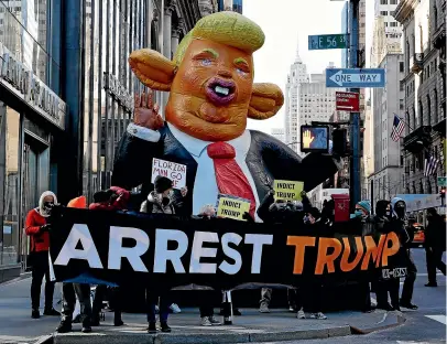  ?? GETTY IMAGES ?? People protest against the former US president Donald Trump at Trump Tower in New York.