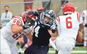  ?? Jeremy Stewart / RN-T ?? Berry lineman Tyler Bertolinni (34) works against Huntingdon’s Josh Horwitz (68) to get to quarterbac­k Michael Lambert (6) during the fourth quarter of Saturday’s NCAA Division III playoff game.