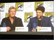  ??  ?? Actors William Zabka and Ralph Macchio, shown on a monitor, speak at the “Cobra Kai” panel at Comic-Con.