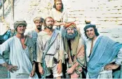  ??  ?? Terry Jones, right, who has died aged 77. Above, with the rest of the Python team on the set of Life of Brian. Sir Michael Palin, left, said he was ‘the most wonderful friend’