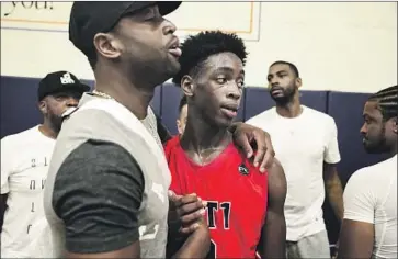  ?? Cassy Athena Getty Images ?? NOW RETIRED, former NBA All-Star Dwyane Wade, left, says he’s looking forward to watching his son, Zaire, play ball for Sierra Canyon. Zaire is a senior while Bronny James, son of LeBron James, is a freshman.