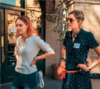  ??  ?? Saoirse (also below) and Greta on the set of critically acclaimed Lady Bird