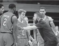  ?? Gregory Shamus / Getty Images ?? As Texas Tech’s coach, Chris Beard and the Red Raiders won seven of the last nine games against Shaka Smart’s Texas team.