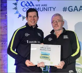  ??  ?? Jim McCarthy, representi­ng St John’s Volunteers GAA Club, is presented with the Official Healthy Club Award by Seán Cavanagh, Healthy Clubs Ambassador and former Tyrone Footballer, at a ceremony in Croke Park.