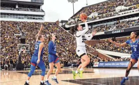  ?? CRESS/FOR THE REGISTER - USA TODAY NETWORK FILE JOSEPH ?? Iowa guard Caitlin Clark shoots in an exhibition game against DePaul on Oct. 15 at Kinnick Stadium in Iowa City, Iowa. The game drew 55,646 fans.