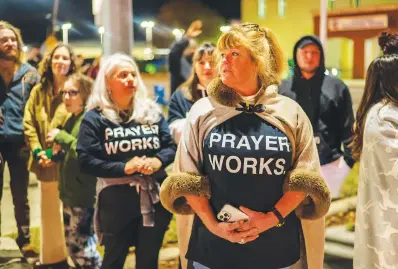  ?? (Photo for The Washington Post by Sergio Flores) ?? Christy Ballard wears a shirt that reads “Prayer Works” during the ministers’ group-sponsored Christmas parade in Taylor, Texas.