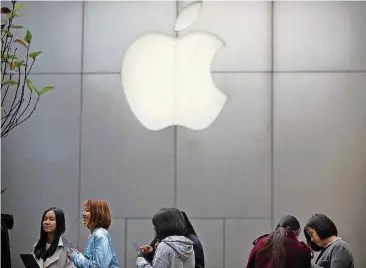  ?? [AP FILE PHOTO] ?? On Wednesday, Apple announced it is planning to build another corporate campus and hire 20,000 workers during the next five years as part of a $350 billion commitment to the U.S. economy.