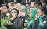  ?? PICTURE: PA WIRE. ?? EMOTIONAL: Families of victims of the Grenfell Tower disaster attend a service at the base of the tower.